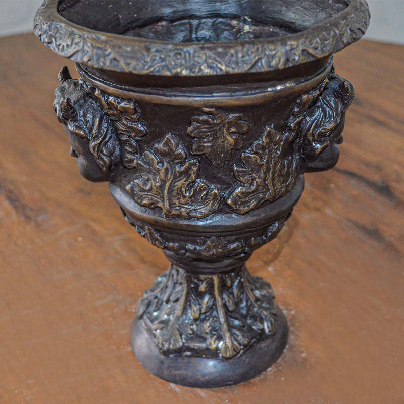Small Greco-Roman Urn with Cherub Faces and Palmettos in Bronze Patina