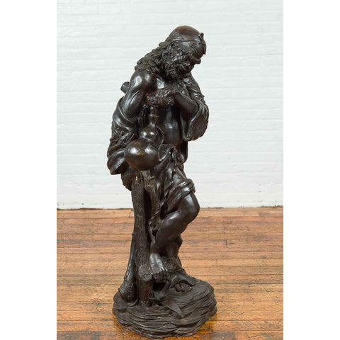 Vintage Bronze Sculpture Depicting a Mythical Warrior Holding a Flask