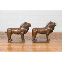 Pair of Bronze Lion Sculptures on Bases with Dark Patina