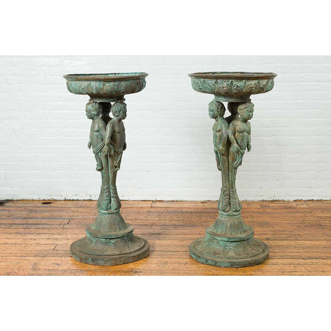 Bronze Classical Style Pedestal Urn with Putti Carrying a Basin on Their Heads