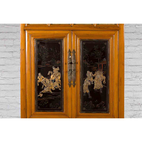 Chinese Early 20th Century Lacquered Armoire with Gilt Carved Warrior Motifs