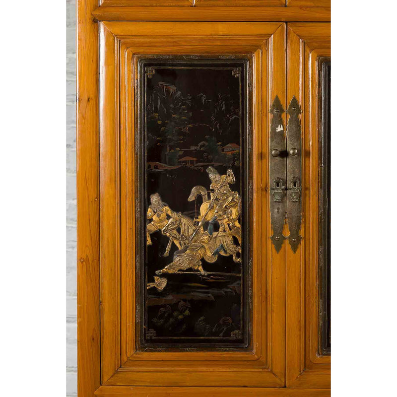 Chinese Early 20th Century Lacquered Armoire with Gilt Carved Warrior Motifs