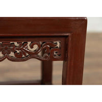 Vintage Chinese Side Table with Dark Red Patina and Foliage Hand Carved Apron