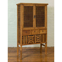 Indonesian Cabinet with Rattan Doors, Drawers and Fretwork Sliding Panels