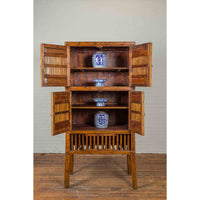 Chinese Vintage Wood and Bamboo Cabinet with Double Doors and Openwork Apron