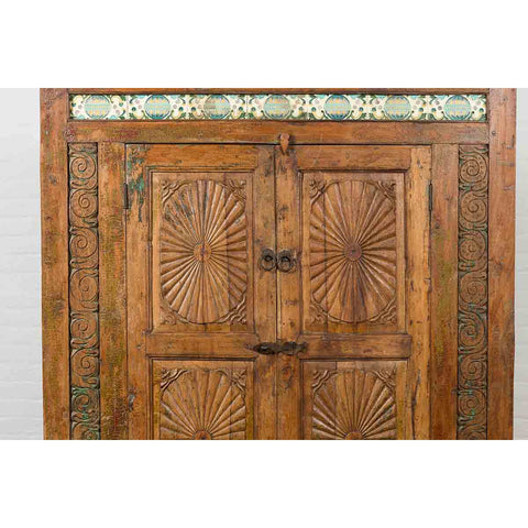 Indonesian 19th Century Cabinet with Sunburst Design and Blue & Yellow Enameled Tiles