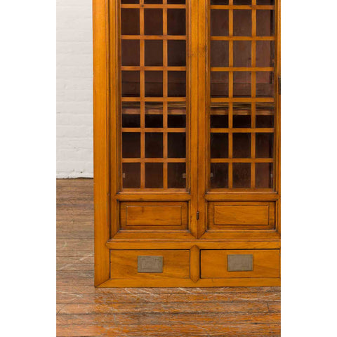 Chinese Vintage Display Cabinet with Paneled Glass Doors and Four Drawers