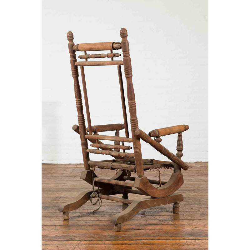 Rustic 19th Century Indian Rocking Chair with Metal Accents and Turned Supports