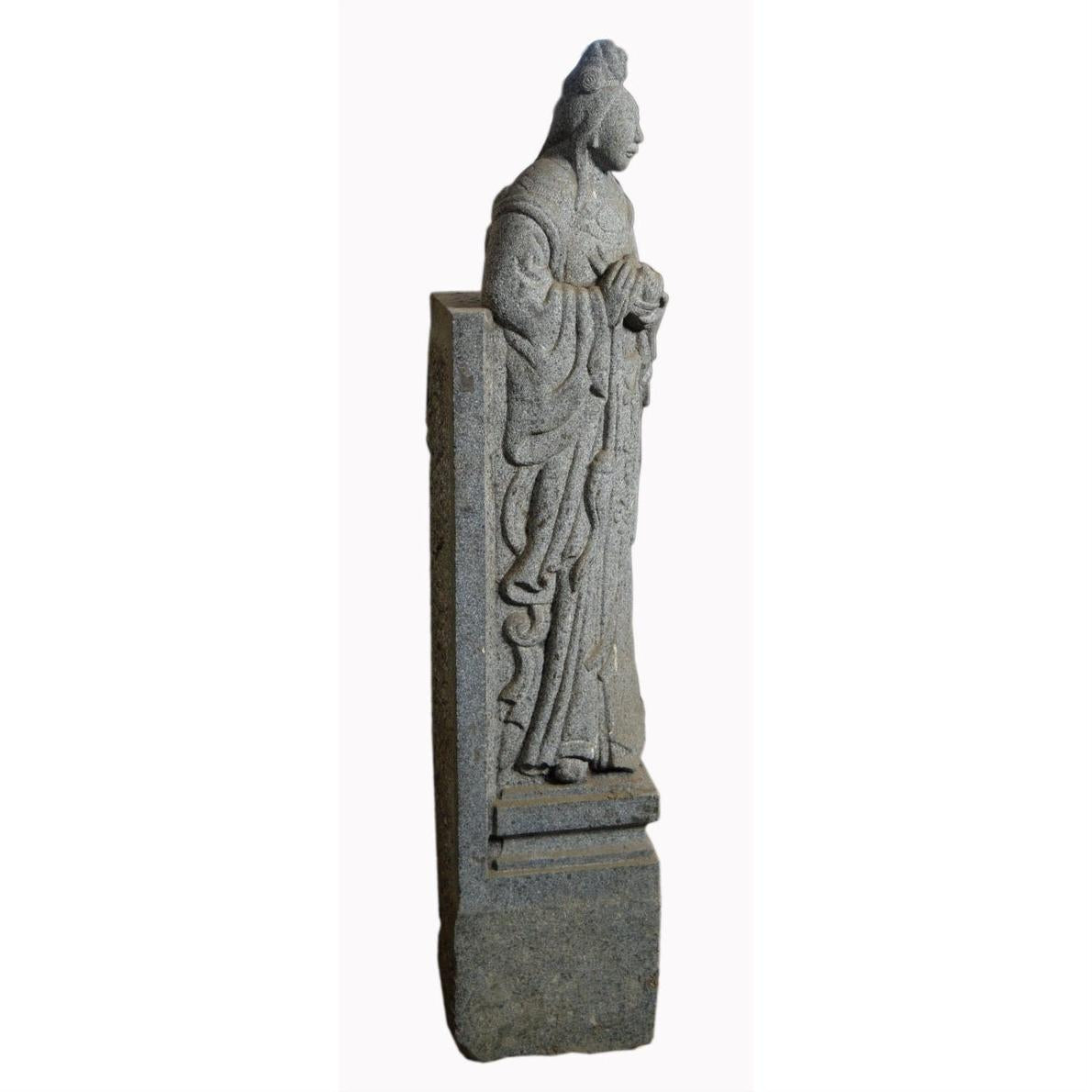 Gray stone Chinese guardian sculpture with carved robe and hair details, 19th century, hand-carved.