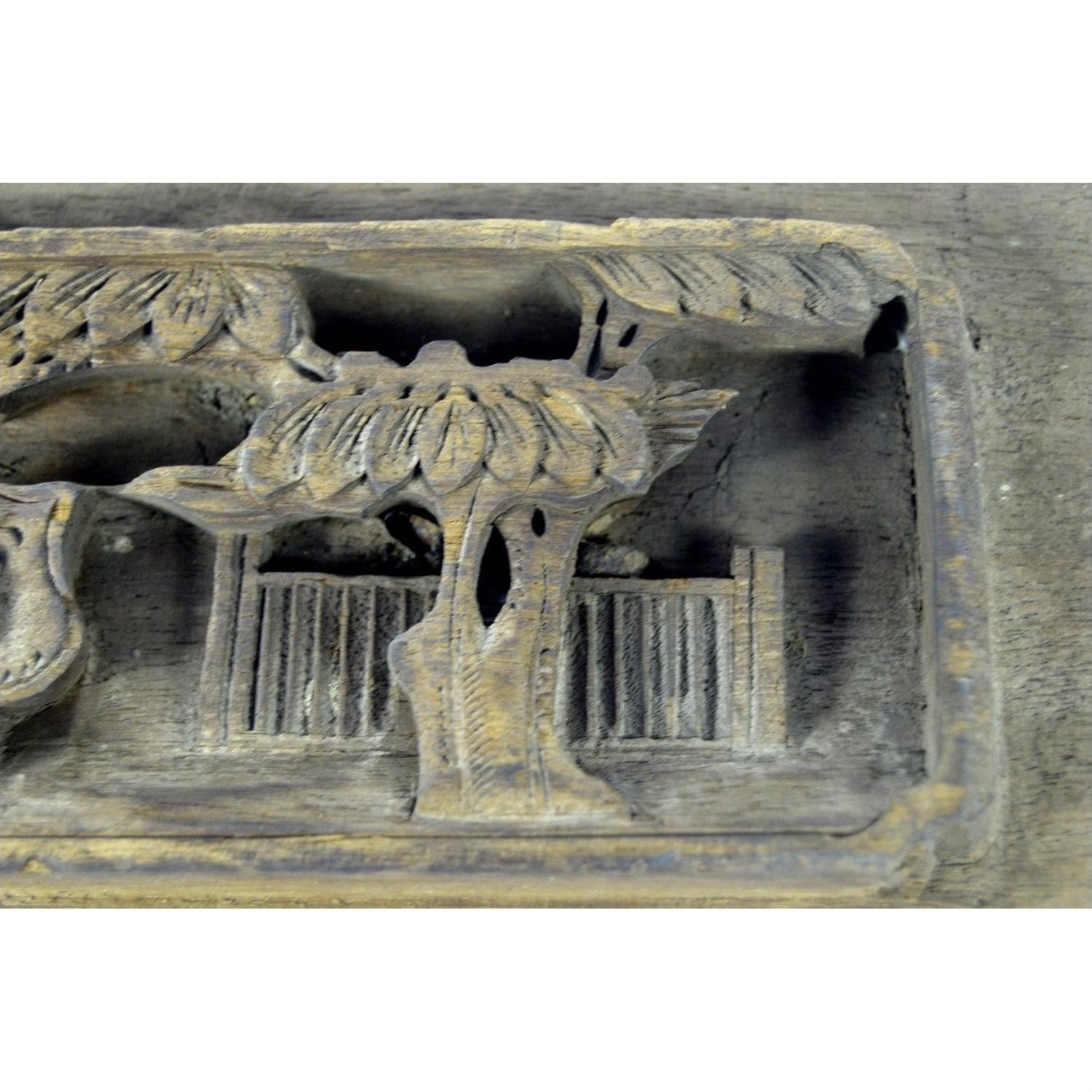 Brown carved wood Chinese temple plaque with trees and fence, rectangular, 12x4x1 inches, good condition.