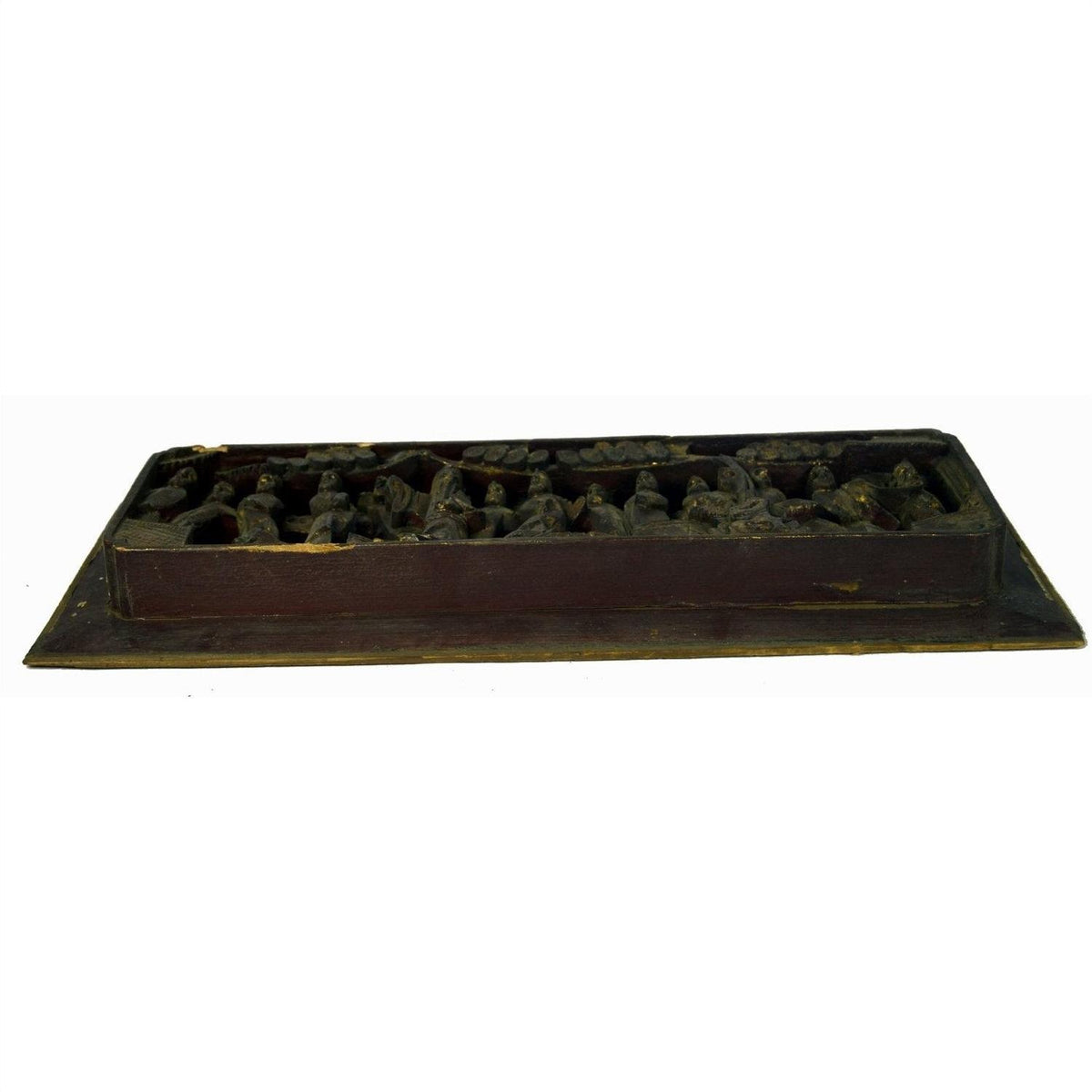 Brown wood temple plaque with raised shapes, antique Chinese style, seen from low angle.