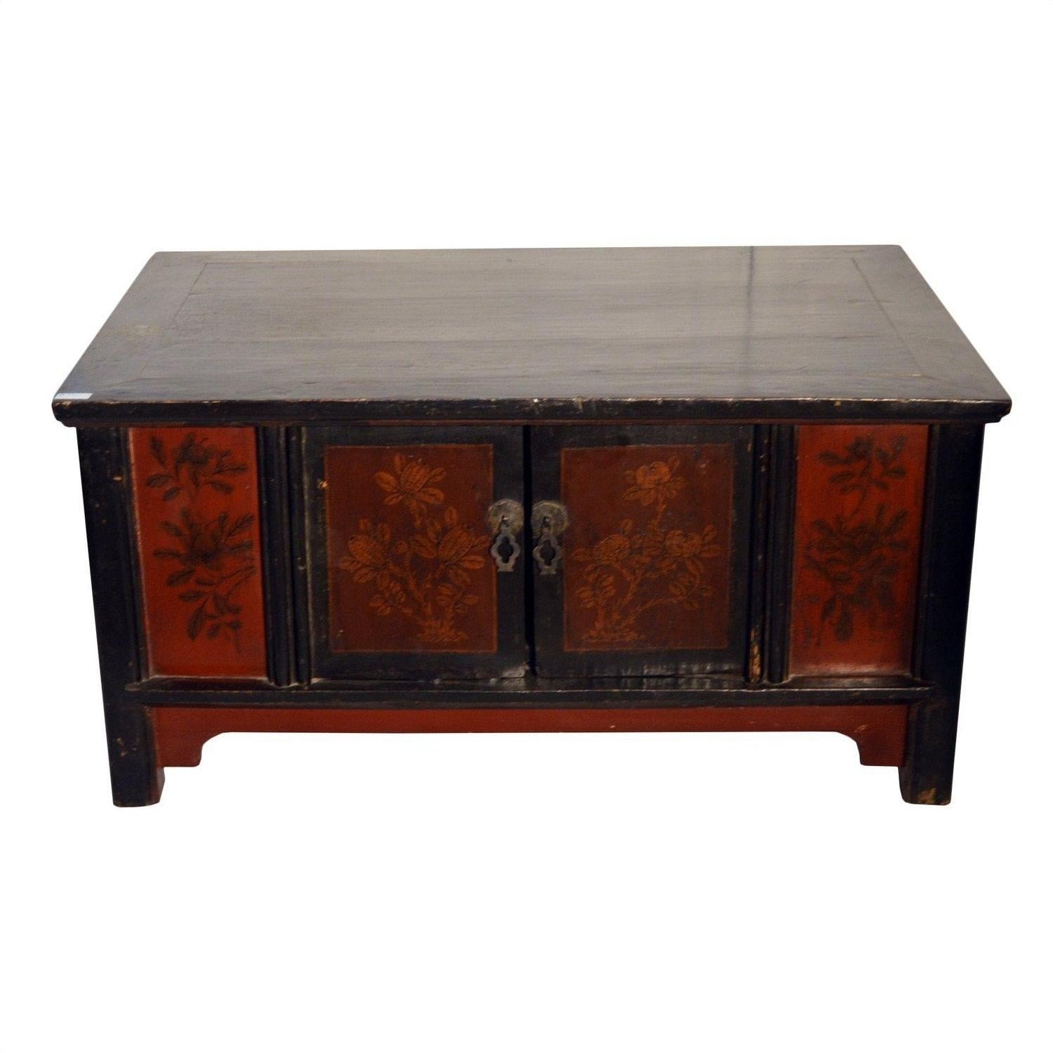 Black lacquer wood cabinet with red floral panels and two central metal handles, antique Chinese style.