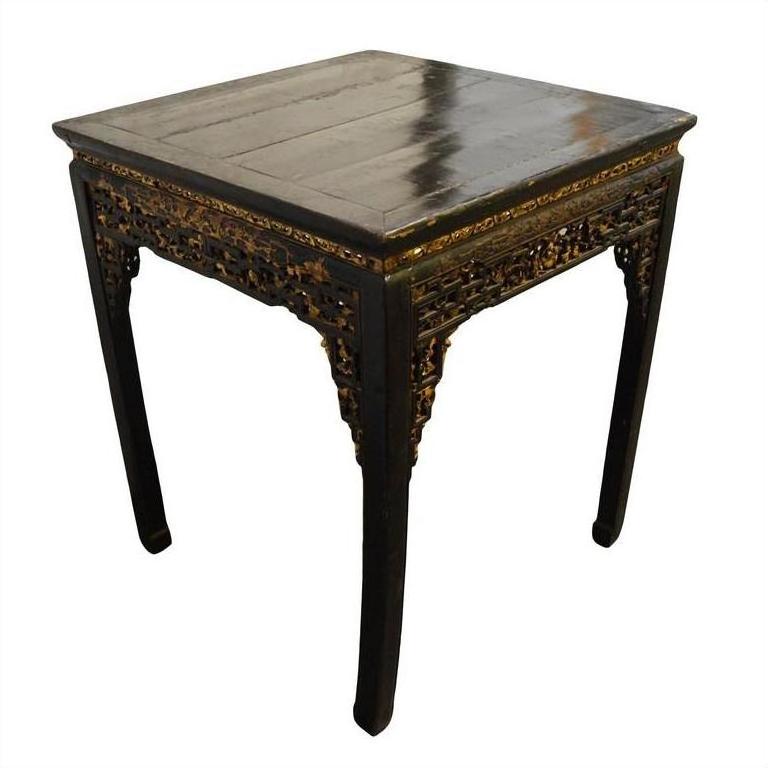 Black lacquer wood altar table with carved floral patterns and curved legs, antique style.
