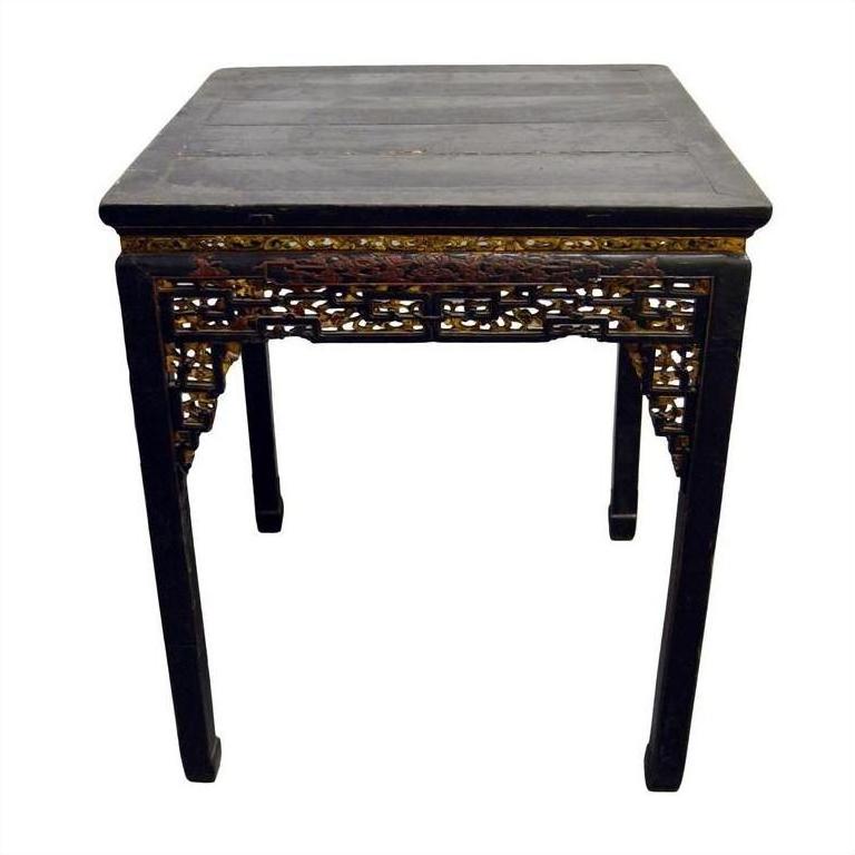 Black lacquer wood altar table close-up, antique Chinese style, showing carved details.