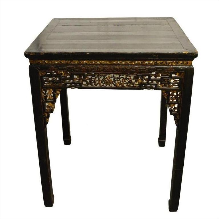 Black lacquered wood Chinese altar table with hand-carved apron and straight legs, full front view.