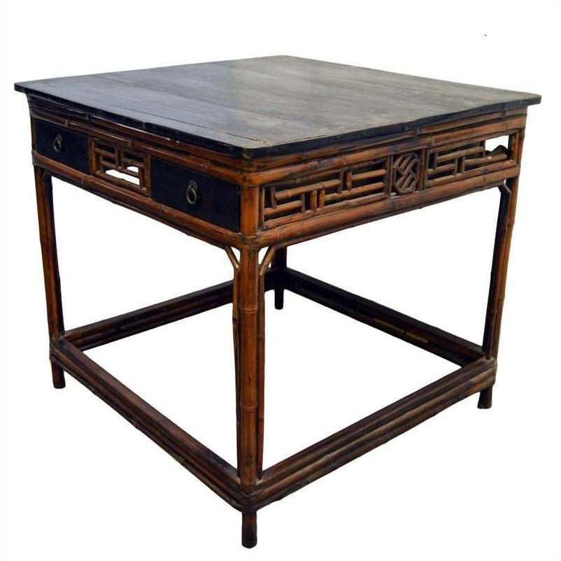 Black lacquered wood Chinese table with drawers, bamboo leg details, antique style, front view.