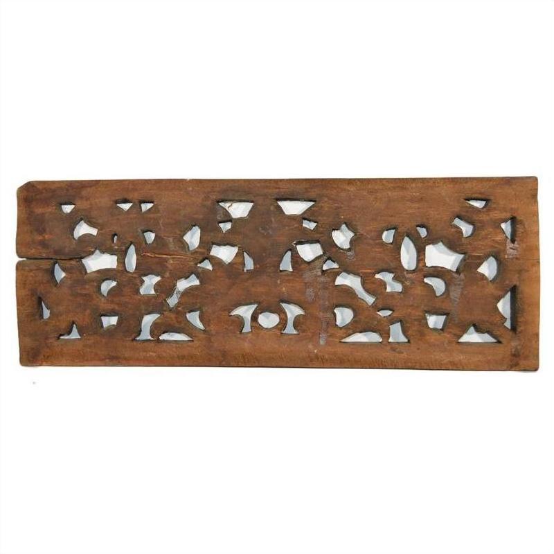 Brown teak wood floral lattice panel with abstract cut-out patterns, antique Chinese carving, close-up view.