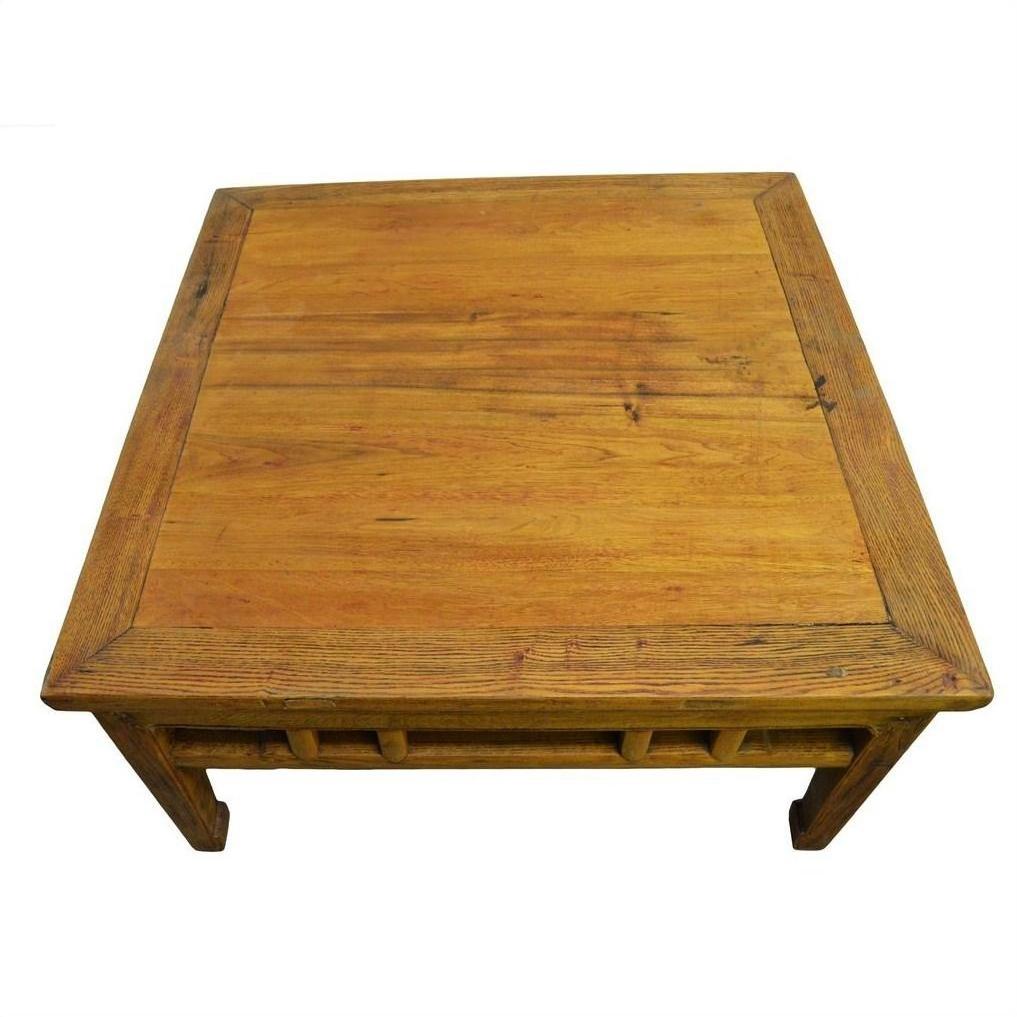 Light brown wood Chinese coffee table with visible wood grain, top view.
