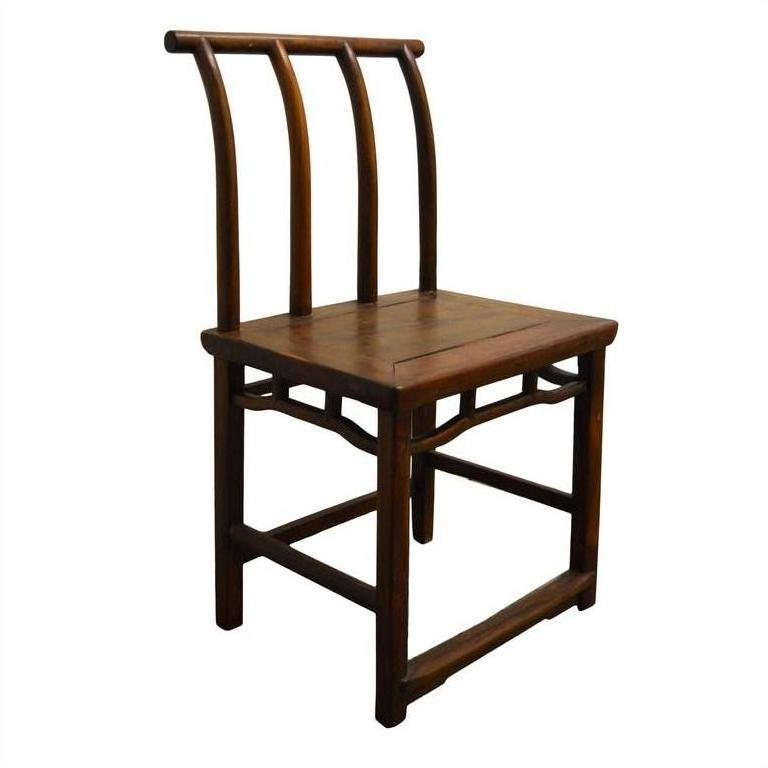 Dark wood Chinese elm chair with curved back and three vertical slats, antique handmade design, studio close-up.