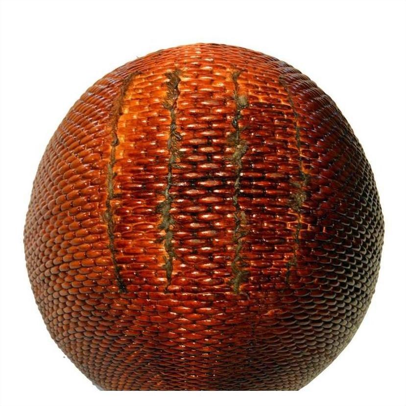 Close-up of a brown antique Chinese grain basket with textured surface and classic design on a white background.