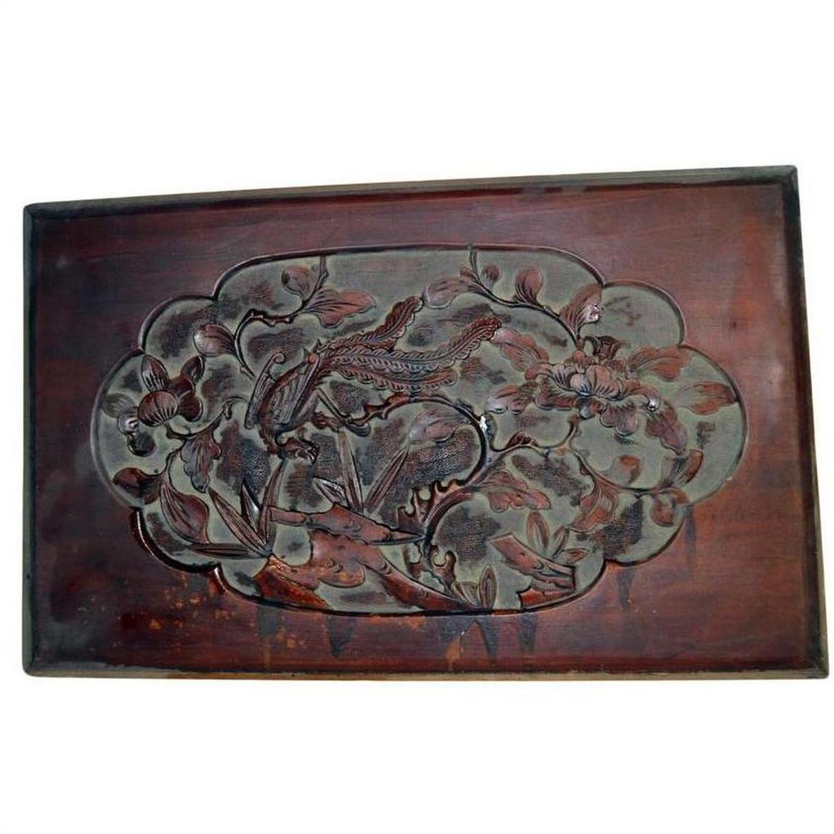 Dark rosewood lacquered Chinese wall plaque with hand-carved birds and flowers design, close-up view.