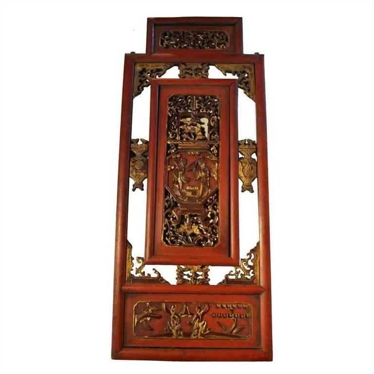 Red gilt wood Chinese carved panel with intricate relief depicting a courtyard scene, close-up view.