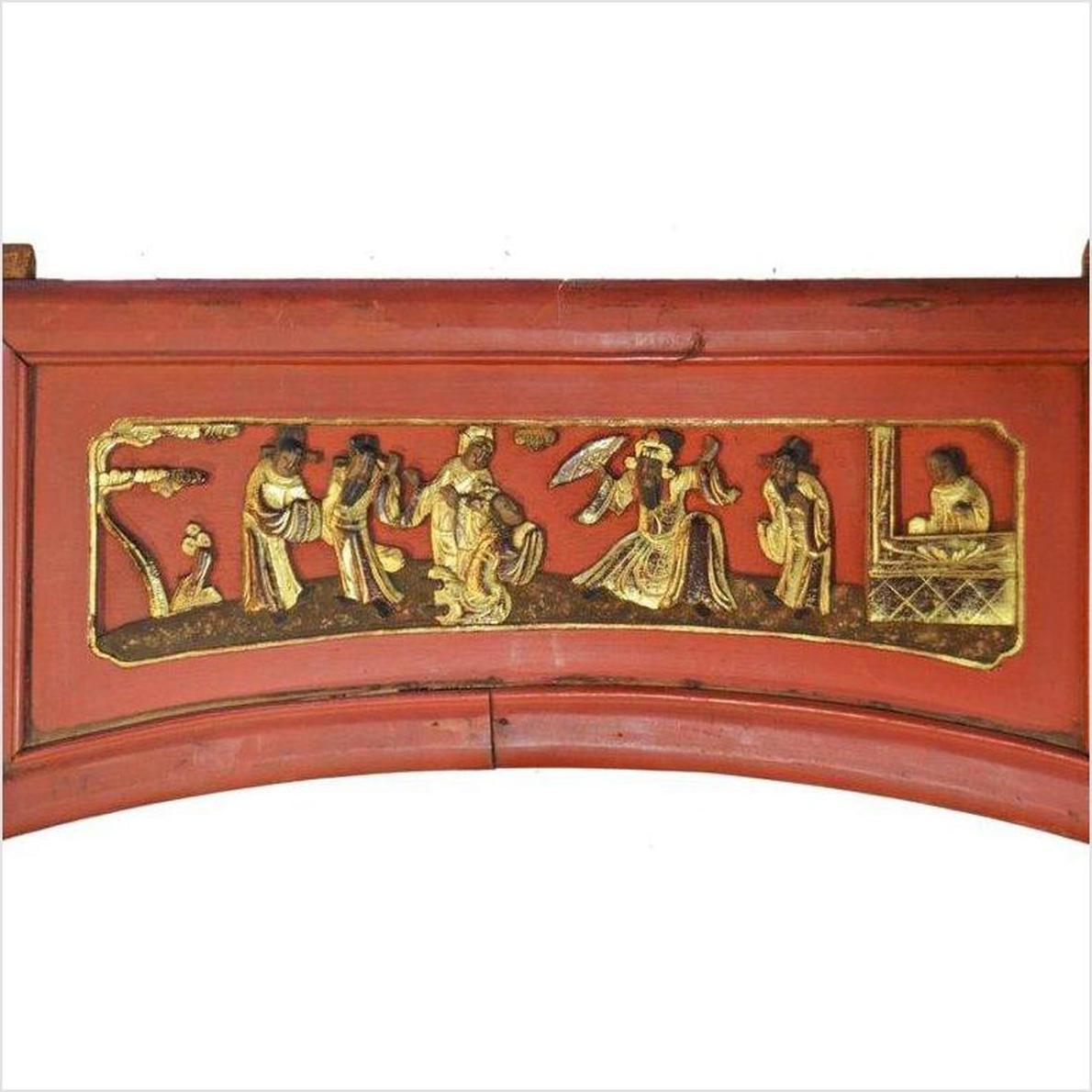 Red wooden sign with gilded carved figures in traditional dress, arched bottom, antique Chinese design.