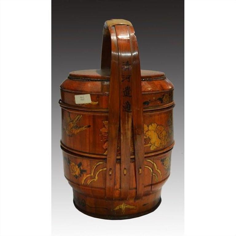 Brown bamboo hand painted basket with curved handle, floral designs, and decorative Chinese characters, close-up.