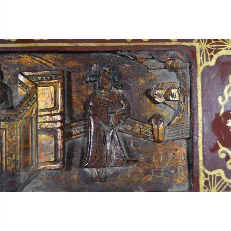 Black lacquer wooden box with central latch and ornate stylized bird design, shown on neutral background.