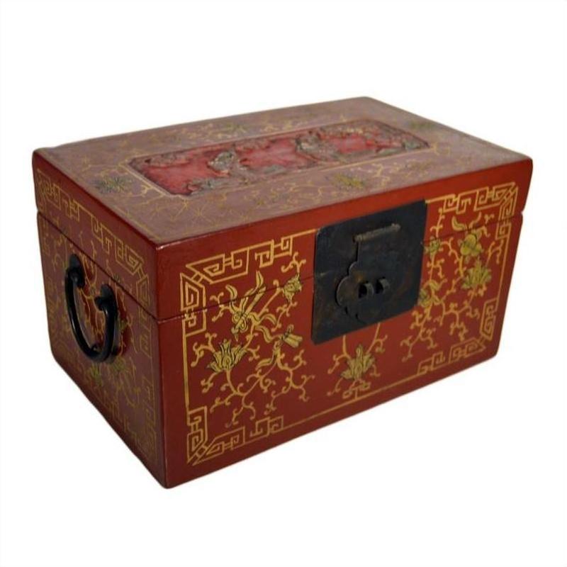 Close-up of red lacquer antique Chinese box with gold floral inlay, metal lock, and side handle.