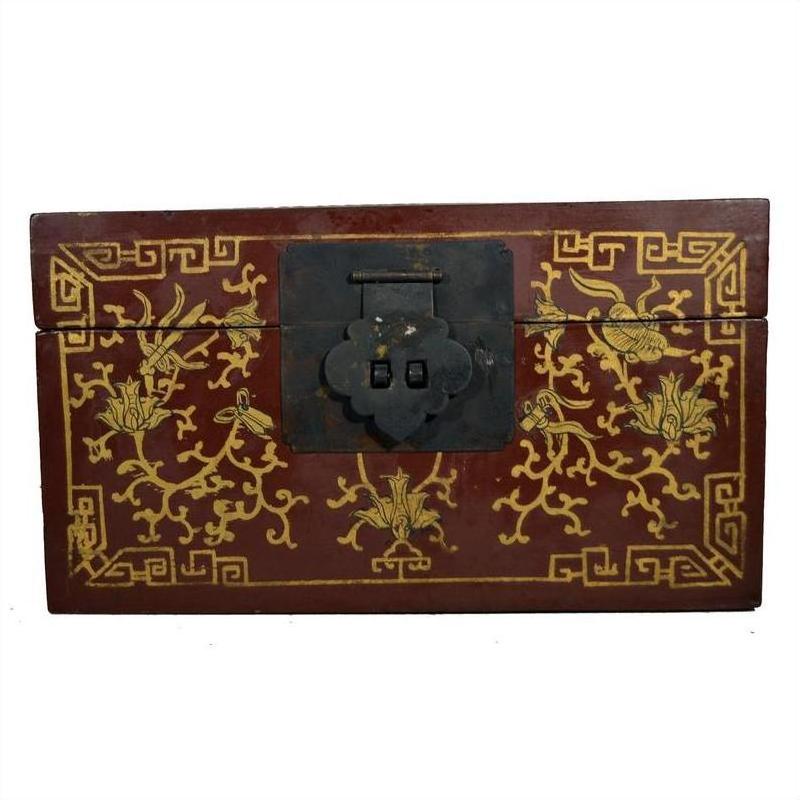 Black and gold lacquer box with gilt floral patterns, scenic lid, and dancing figures, shown close-up.