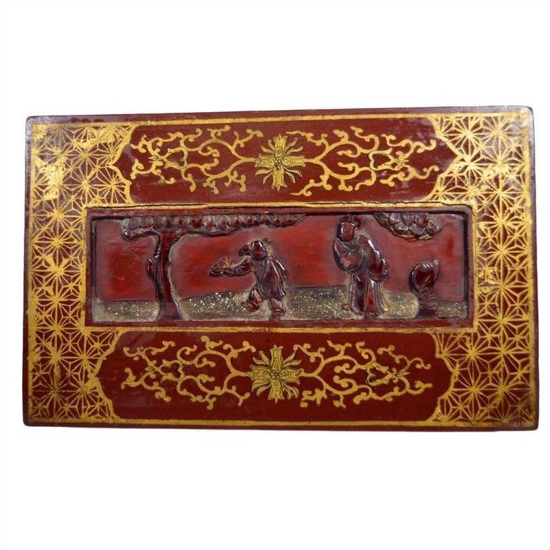 Black and gold lacquer antique Chinese rectangular box with gilt geometric and floral designs, dancing figures on lid.