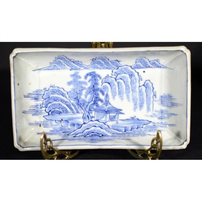 Blue and white porcelain tray featuring a landscape design with pavilion and willow trees.