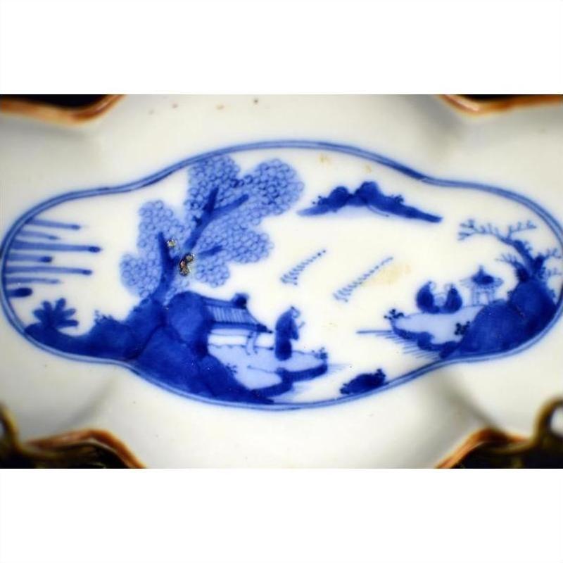 Blue and white porcelain cloud-form dish with Chinese landscape scene, river view, figural design.