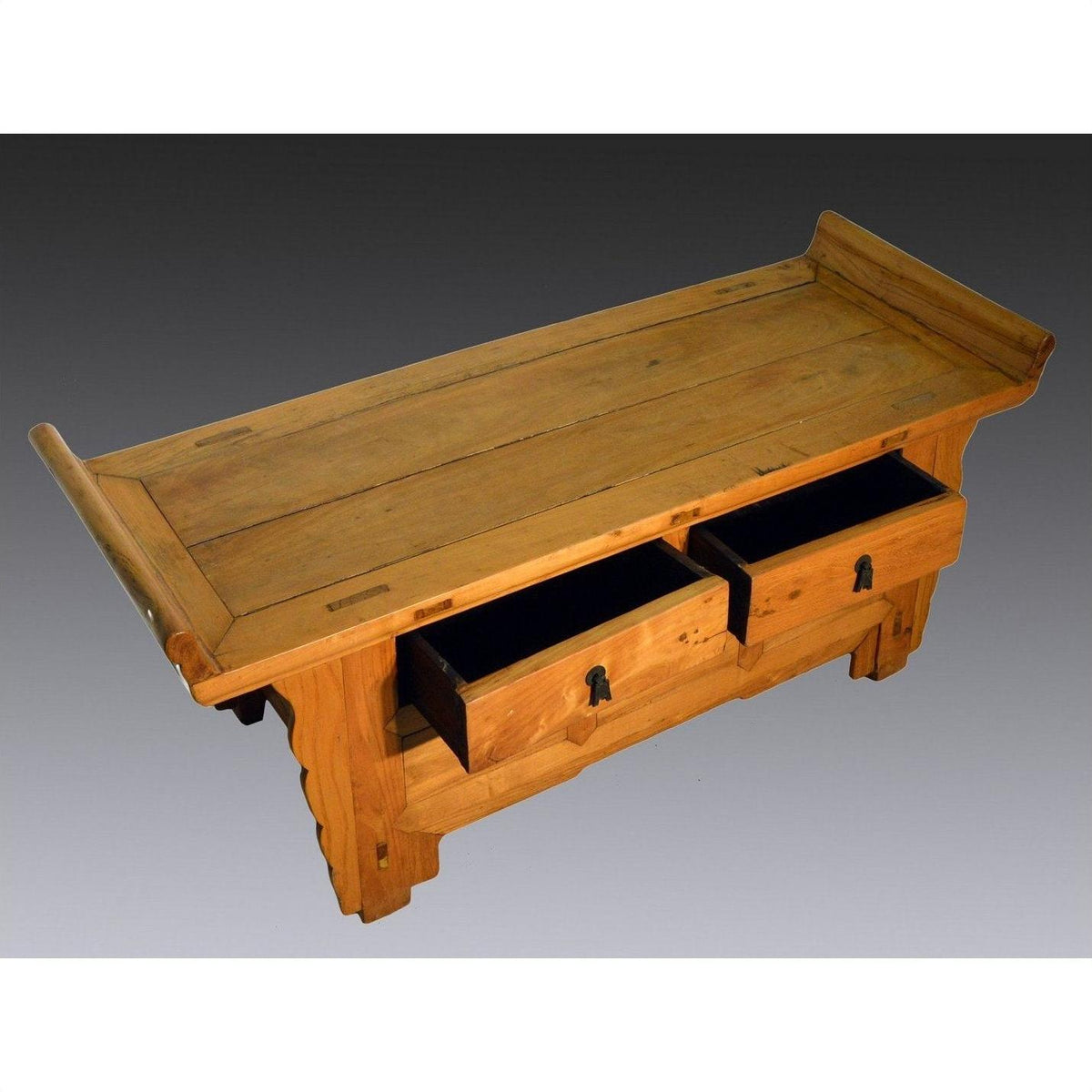 Dark wood antique Chinese Kang low cabinet with everted flanges, open drawers, and decorative side supports.