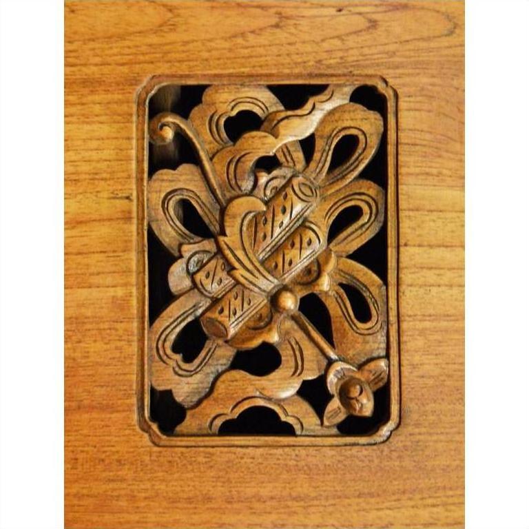 Brown walnut Chinese kitchen cabinet with hand-carved framework design, front view.