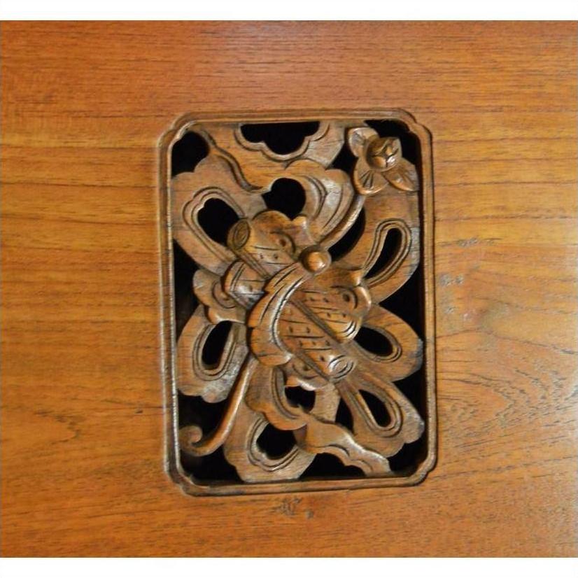 Dark polished wood Chinese kitchen cabinet with hand-carved framework design, front view.