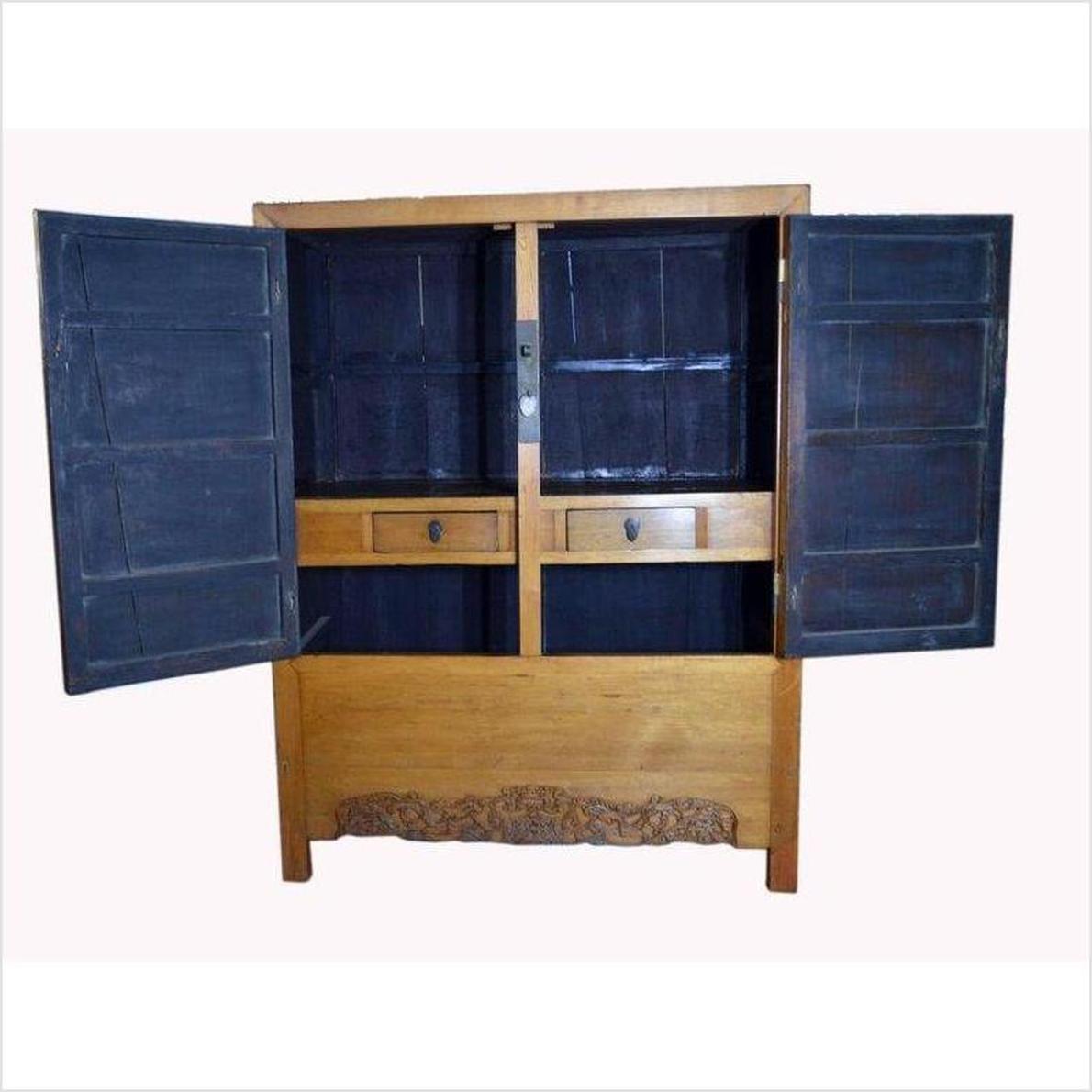 Black lacquered antique Chinese cabinet with brass hardware, doors, and drawers against a light background.
