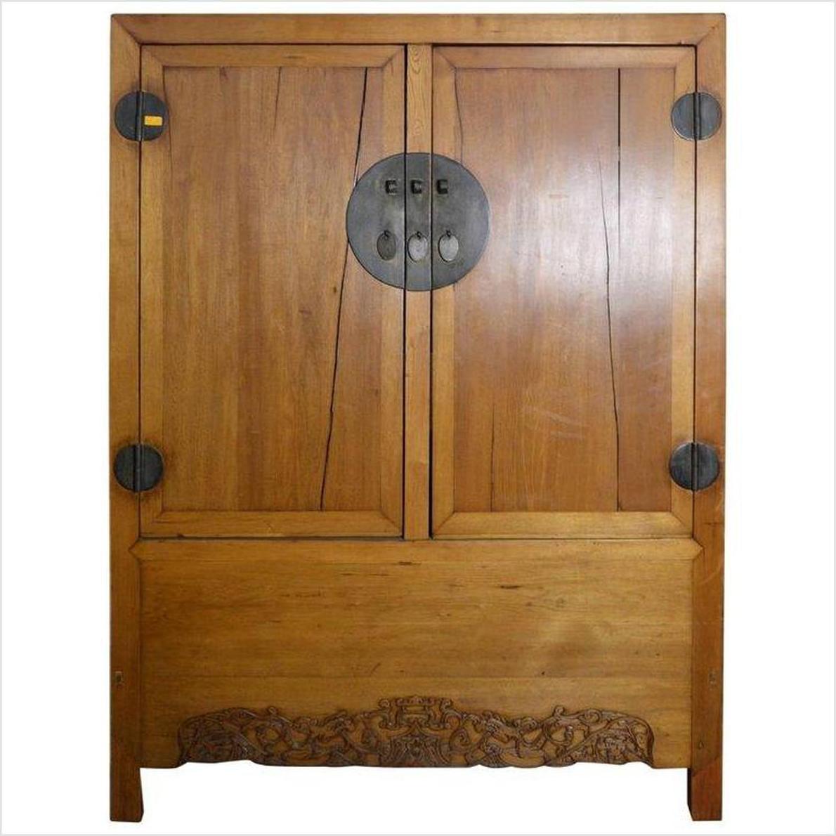 Black and red lacquered wood Chinese cabinet with brass hardware, doors, and drawers, front view.