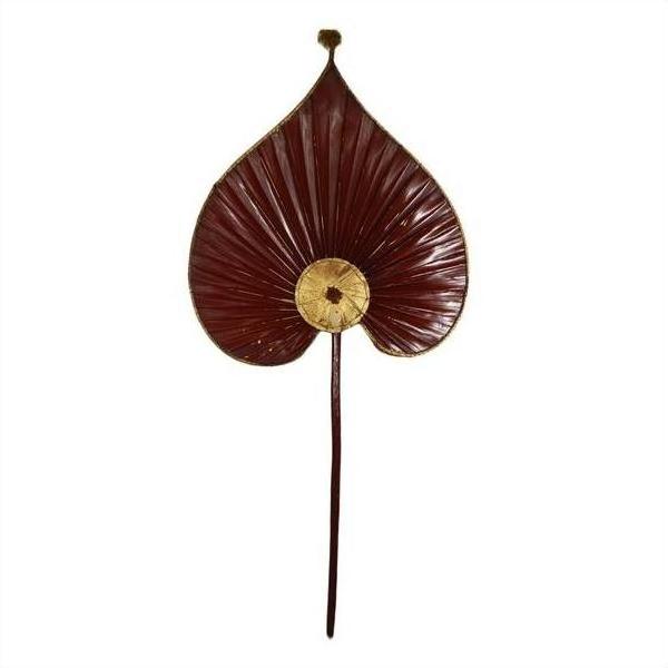 Close-up of two antique Chinese heart-shaped fans, dark red with gold accents, inspired by ceremonial flags.