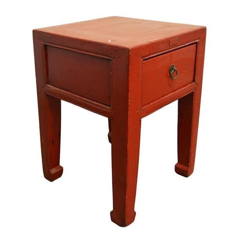 Red lacquered wood side table with a single drawer, metal ring handle, and four straight legs, antique style.