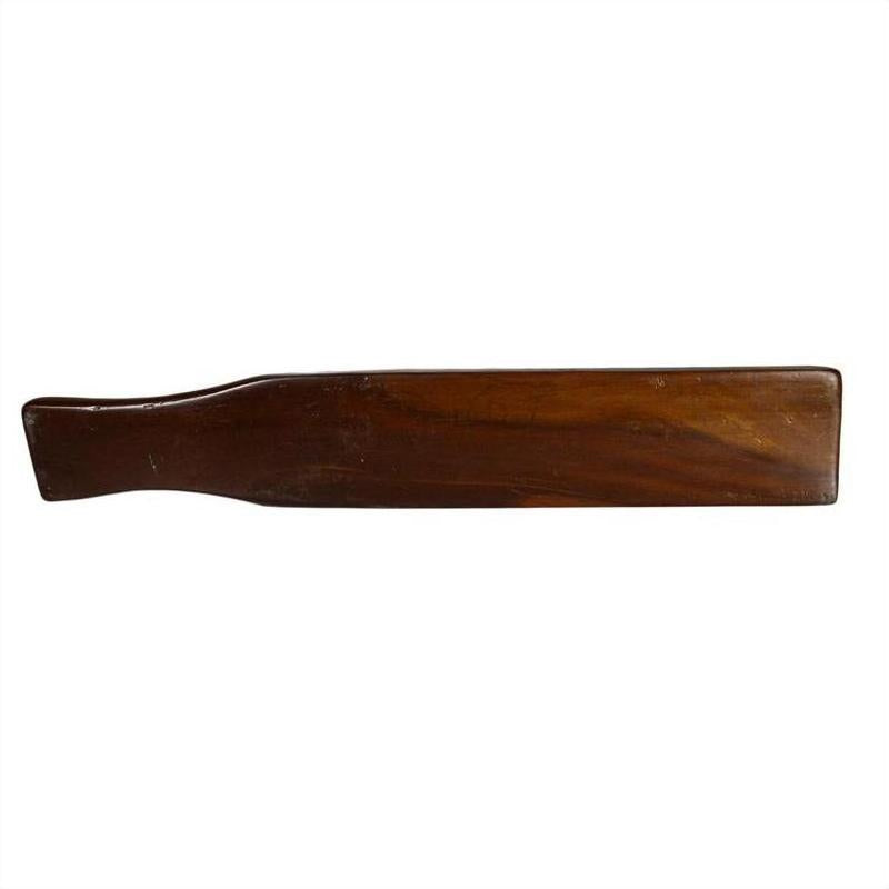 Close-up of antique Chinese rice mold with dark wood rectangular blade and curved handle on neutral background.