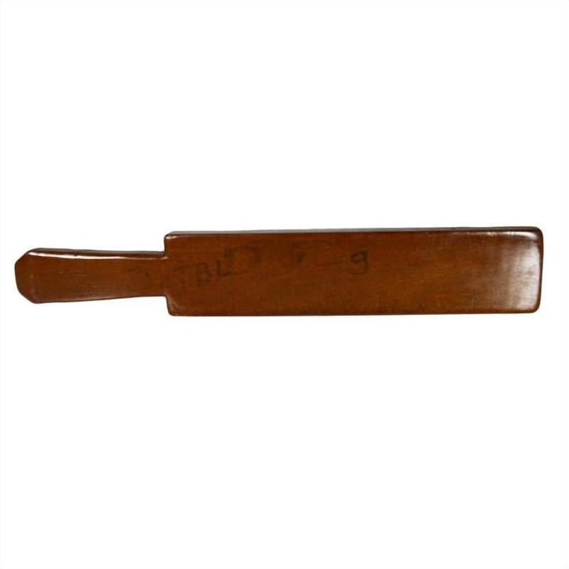 Brown antique Chinese rice mold with six rectangular motifs and incised characters, close-up on white background.