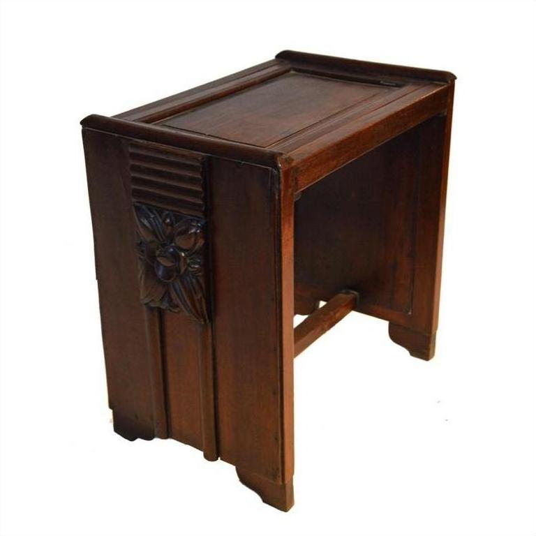 Brown rosewood side table with carved floral and panel details, shown on a white background.