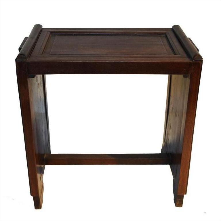 Dark rosewood side table with a rectangular top, raised edges, and sturdy legs with horizontal support.