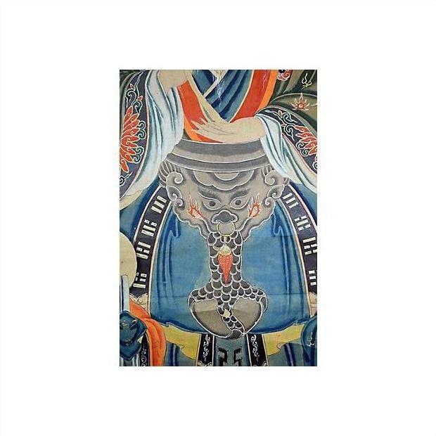 Colorful paper Chinese scroll painting with detailed stylized dragon and vibrant ornate Asian patterns, close-up view.
