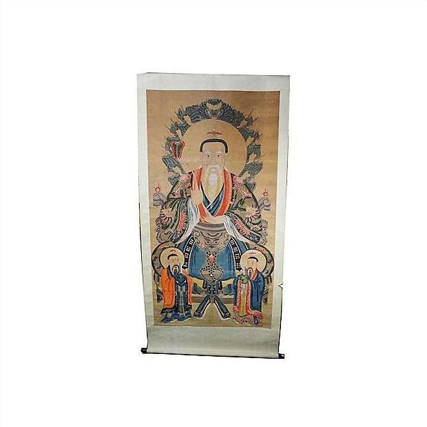 Antique Chinese scroll painting on paper showing a seated figure with two attendants and halo-like backdrop.