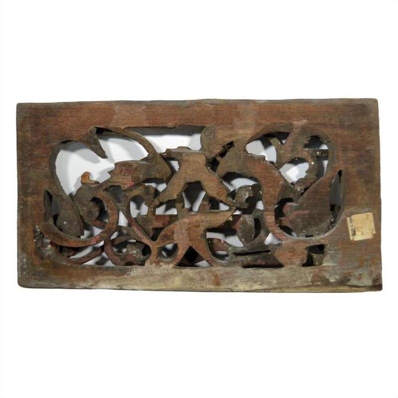 Dark wood rectangular panel with weathered floral and animal carvings, antique finish, rustic appearance.