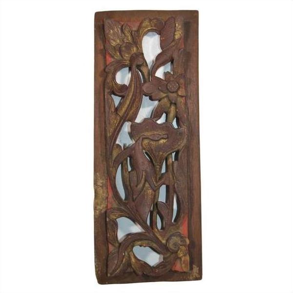 Close-up of reddish-brown wood Chinese carving with vertical peony spray and intricate floral and leaf patterns.