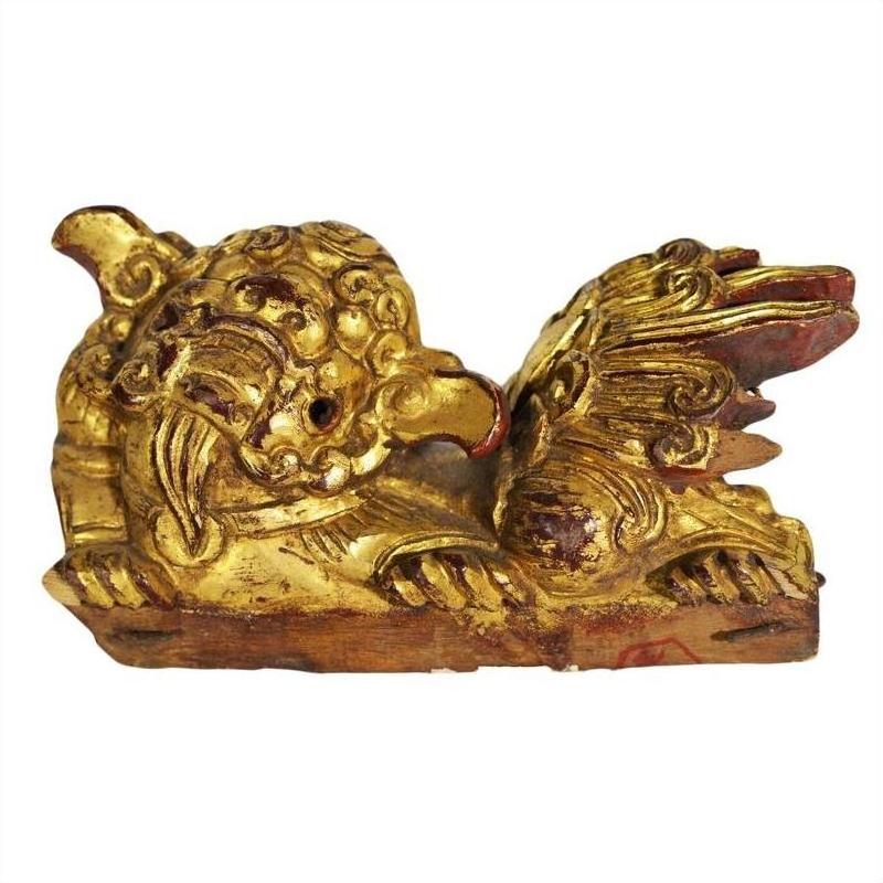 Pair of ornately carved wood Chinese temple dragon carvings, detailed close-up view, antique finish.